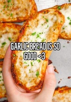 someone holding some bread in their hand with the caption garlic bread is so good > 3