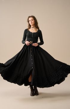 Step back in time with our Victorian Style Skirt, where every stitch reflects exceptional craftsmanship. Revel in the elegance of this skirt adorned with a graceful flare that flows seamlessly as you walk or dance, creating a captivating presence at the Renaissance Festival or any historical event.  You'll be pleased with these ruffles. Why not pair it with a simple, casual blouse and let this skirt be the focal point of your look. 【Fabric】 100% linen. 220g/gram. thick weight. It is washed with special technique and not easy to wrinkle. 【Size】 *SIZE XS waist: 26"/ 65 cm *SIZE S waist: 27"/ 70 cm *SIZE M waist: 29/ 75 cm *SIZE L waist: 31.5" / 80 cm SIZE XL Waist: 33"/ 85cm SIZE XXL waist : 35" / 90 cm SIZE 3XL waist : 37" / 95 cm Bohemian Midi Dress With Ruffled Skirt, Spring Gothic Long Maxi Skirt, Black Bohemian Dress With Tiered Skirt, Spring Gothic Maxi Skirt, Bohemian Fitted Midi Dress, Flowy Black Bohemian Maxi Skirt, Bohemian Black Flowy Maxi Skirt, Fall Dresses With Ruffled Long Skirt, Black Bohemian Gathered Maxi Skirt