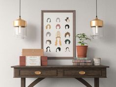 a table with some books and plants on top of it next to a framed portrait