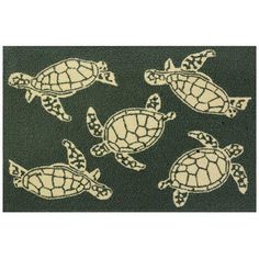 four sea turtle rugs in green and white on a black background, each with an intricate design