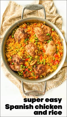 a pan filled with chicken and rice on top of a table