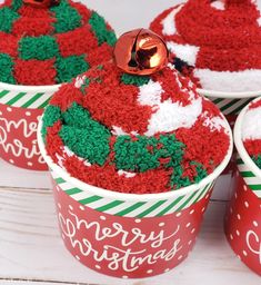 red and green cupcakes decorated with christmas decorations