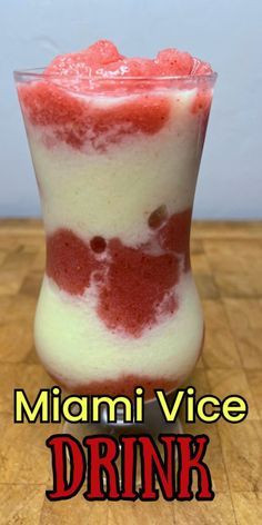 a drink with red and white liquid in it