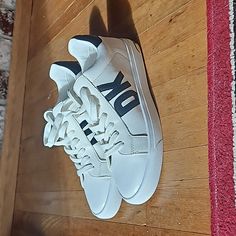 Dkny White Shoes With Black Logo And Silver Trim. New Never Worn! Perfect For Everyday Use Or To Add To A Collection. Shoes Will Not Come With A Shoebox But Are New And Never Worn Dkny Logo, Dkny Shoes, Logo Shoes, Shoes Color, Black Logo, White Shoes, Shoe Box, Mens Shoes Sneakers, Mississippi