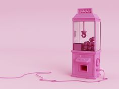 a pink toy machine sitting on top of a table