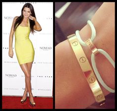 a woman wearing a yellow dress and gold bracelets on her left wrist, and an image of a women's hand holding a ring