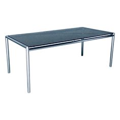 a glass table with metal legs on a white background