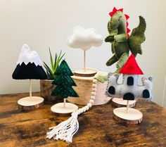 several small wooden trees and decorations on a table