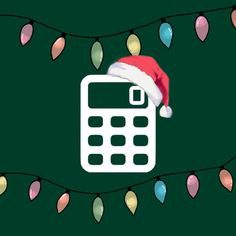 a calculator with a santa hat on it is surrounded by christmas lights and garlands