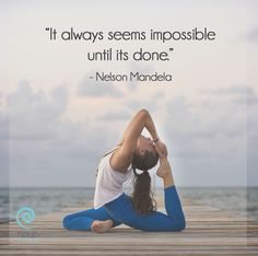 a woman doing yoga on a dock with a quote above her that reads, it always seems impossibleble until its donee