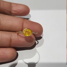 14k solid yellow gold natural oval shaped yellow sapphire precious gemstone ring. 1. The weight of the natural yellow sapphire gemstone used in the ring =0.63 cts. 2. The weight of the 14k solid yellow gold used in the ring =0.950 grms. The sapphire is the birthstone for the people born in the month of September. The ring is very nice and beautiful. Thanks Oval Yellow Sapphire Ring Gold Women, Yellow Sapphire Ring Gold Women, Yellow Sapphire Rings, Gold Sapphire Ring, Lovely Ring, Ring Photos, Yellow Sapphire, Sapphire Gemstone, Precious Gemstones