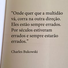 an open book with the words charles bukowski written in spanish and english