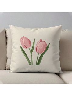 two pink tulips printed on a white pillow