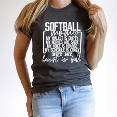 "This Softball Mom Shirt is the perfect way to show off your love and support for your daughter's softball team. This Bella Canvas unisex t-shirt comes in your choice of color, and features a cute and funny message that reads, \"SOFTBALL MOM - My wallet is empty, my nerves are shot, my voice is hoarse, my schedule is crazy but my heart is full\". Made from high-quality materials, this Softball Mom Shirt is designed to be comfortable and durable, making it perfect for wearing to games, practices, Funny Softball Mom Shirts, Softball Pitcher Shirts, Baseball And Softball Mom Shirts, Softball Mom Shirt Ideas, Softball Tshirts, Softball Apparel, Travel Softball, Softball Mom Shirt