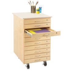 a wooden cabinet with drawers and office supplies on it's top shelf, against a white background