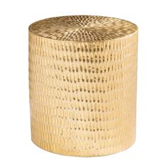 a gold colored stool that is sitting on a white surface and has holes in it