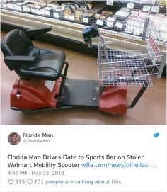 a red scooter sitting on top of a wooden floor next to a shopping cart