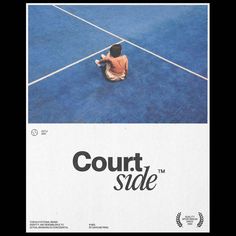 a person sitting on the ground with a tennis racket in their hand and an advertisement for court side