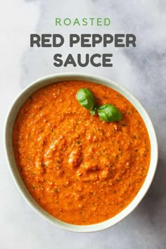 roasted red pepper sauce in a white bowl with basil on top and text overlay