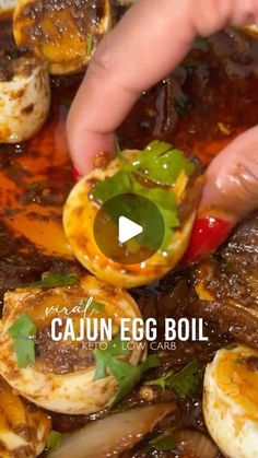 someone is placing an egg on top of some other food in a bowl with sauce