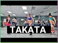 a group of people in a gym with the words atata above them that says,