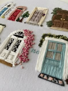 embroidered images of doors and windows on a table