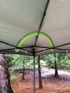 the inside of a tent with trees in the background