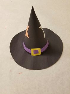 a paper witch hat on top of a table