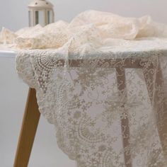 a white table cloth on top of a wooden chair