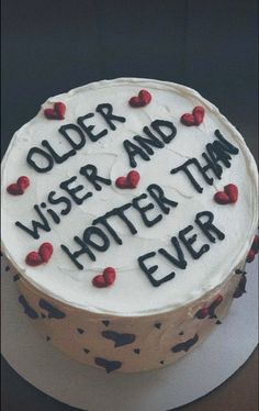 a cake with writing on it that says older and wiser than ever