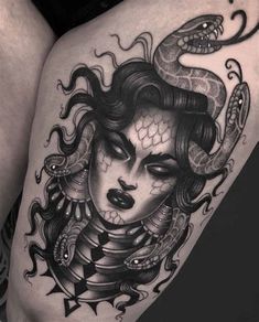 a woman's thigh with a snake on it and her face in the center