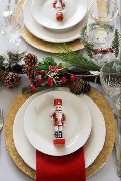 a nutcracker figurine sitting on top of a white plate