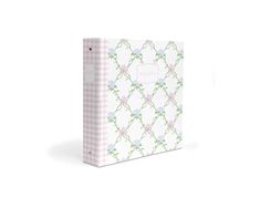 a pink and white checkered binder with floral designs on it, the cover is blank