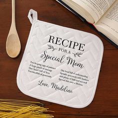 a recipe for a special mom on a pot holder next to a spoon and book