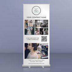 a white roll up banner with photos on the front and back of it, advertising an event