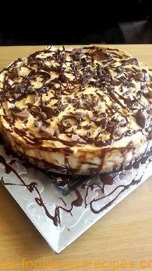 a chocolate covered dessert sitting on top of a white plate