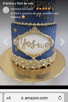 a blue and gold cake with the word yosuve on it's side