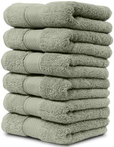 a stack of towels stacked on top of each other in light green color, isolated against a white background