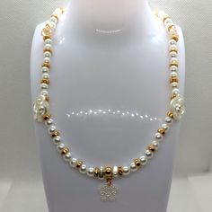 Beautiful pearl gold and flower necklace. Great for summer nights and special occasions Beaded Flower-shaped Pearl Necklace, Elegant Flower-shaped Colorful Beads Jewelry, Adjustable Gold Flower-shaped Beaded Necklace, Vintage Flower-shaped Beaded Necklaces, Yellow Flower-shaped Beaded Necklace, Charm Necklaces, Flower Necklace, Summer Nights, Charm Necklace