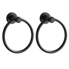 pair of black metal towel rings with round handles on an isolated white background stock photo