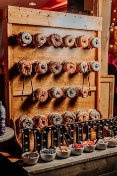 an assortment of donuts on display in a store