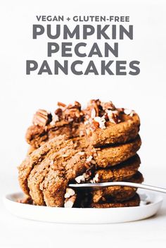 vegan and gluten - free pumpkin pecan pancakes on a white plate