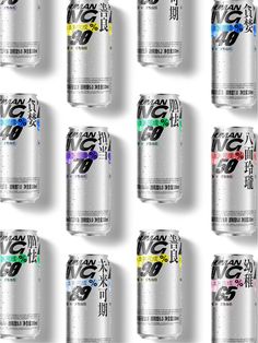 a group of six cans of soda with different colors on the top and bottom half