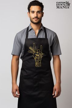 a man wearing an apron with a peace sign on it