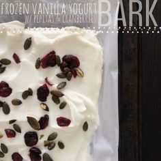 a cake with white frosting and cranberries on it sitting on top of a pan