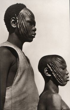 two black men standing next to each other