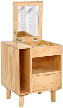 a wooden table with a mirror and drawer on it's side, in front of a white background