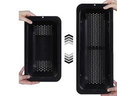 two hands holding black plastic trays with holes