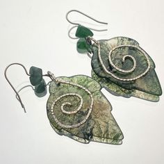 These Stunning One Of A Kind Earrings Are Handmade With Beautiful Carved Moss Agate Leaves, Reclaimed And Hand Hammered Wire, And Upcycled Aventurine Chip Beads. They Are Super Lightweight And Incredibly Versatile, Perfect For Your Accessory Rotation! These Are The Only Ones Of Their Kind So Grab Them Before They’re Gone Forever! Unique Natural Inclusion Drop Earrings, Nature-inspired Drop Earrings With Natural Inclusions, Nickel-free Green Agate Jewelry, Unique Jade Drop Earrings, Nature-inspired Silver Earrings With Natural Stones, Nature-inspired Green Jewelry With Matching Earrings, Green Moss Agate Earrings For Gift, Green Agate Gemstone Earrings, Green Leaf-shaped Sterling Silver Earrings