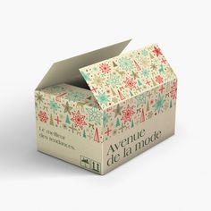 an open box that is decorated with christmas decorations and snowflakes on the inside